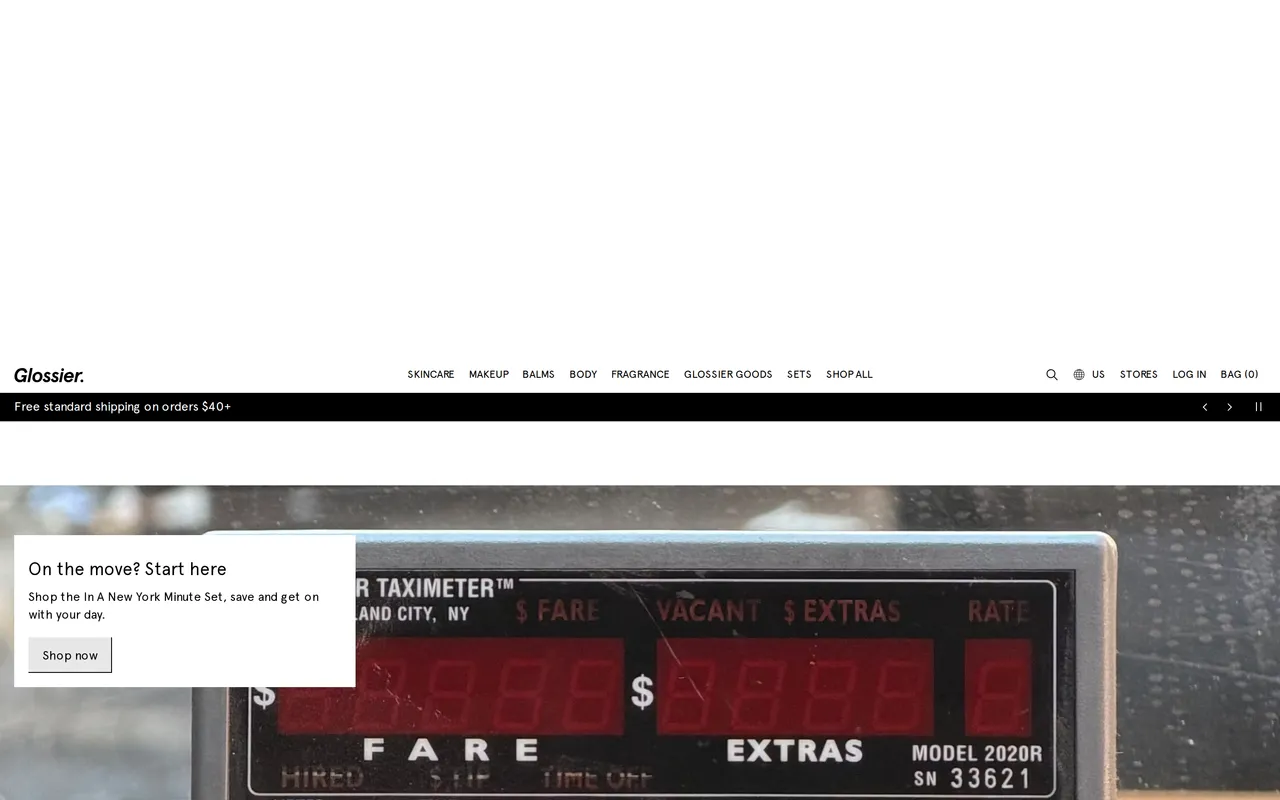 glossier.com homepage with promo banner